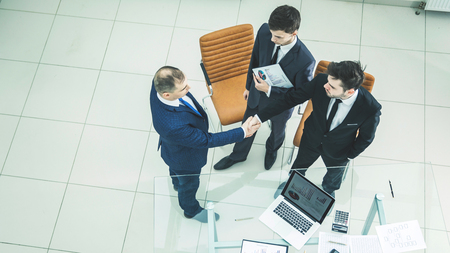 handshake business partners before considering a new financial agreementの写真素材