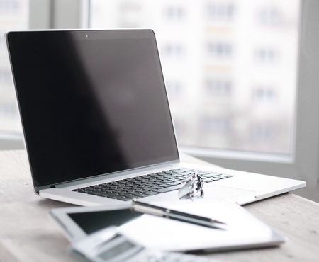 close up.a laptop with a black screen in the workplace in the office