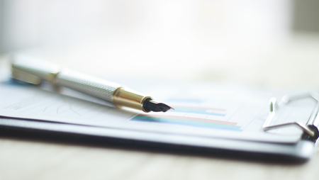 close up. pen and financial chart on the table.business backgroundの写真素材