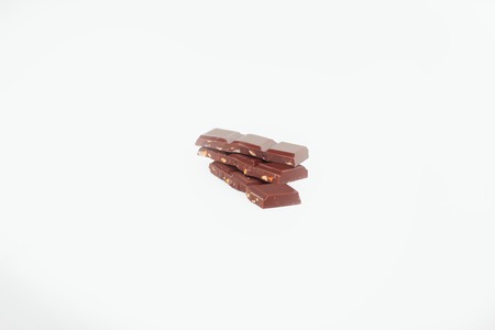 milk chocolate with nuts isolated on white.photo with copy space