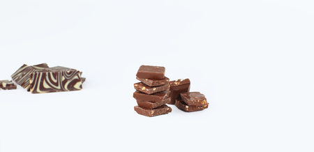 slices of original milk chocolate .isolated on whiteの写真素材