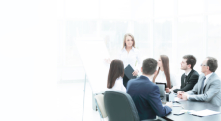 business woman conducting a presentation for business colleaguesの写真素材