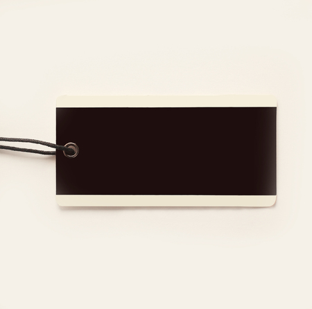 blank decorative tag made of cardboard on a white