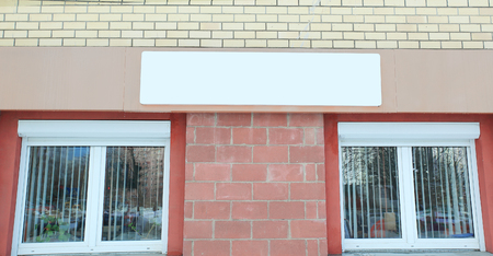 close up.empty sign above the Windows of the houseの写真素材
