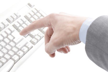 finger hit the button on the old computer keyboardの写真素材
