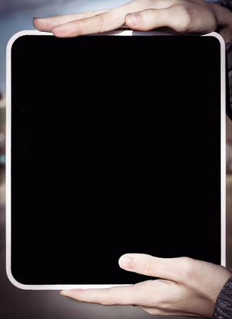 people and technology. closeup. woman showing e-book