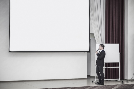 speaker conducts the business of the conference in the modern conference roomの写真素材