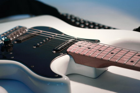 closeup.black guitar on a white background.の写真素材