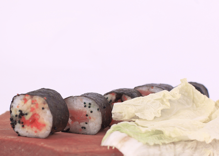 sushi rolls on a cutting Board.isolated on whiteの写真素材