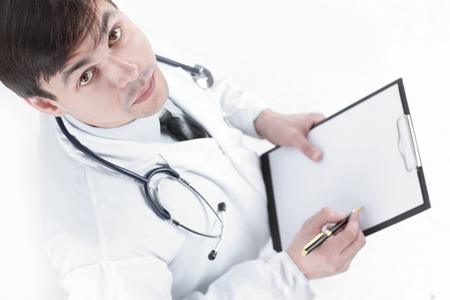 closeup of a doctor holding in his hands a map of the patient.の写真素材