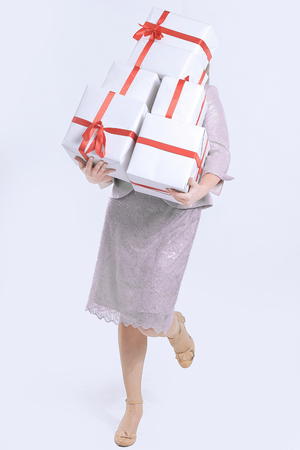closeup of woman with lots of gift boxes.の写真素材
