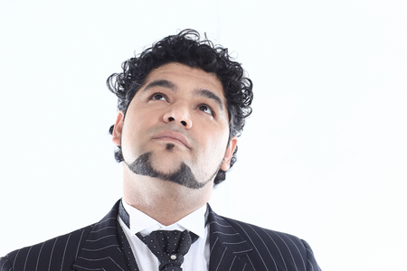 closeup face of a successful businessman who is looking upの写真素材