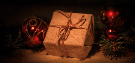 Christmas present on the background of Christmas decorationsの写真素材