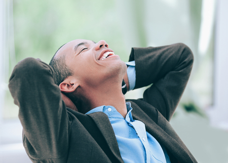 dreaming of a businessman sitting at his Deskの写真素材