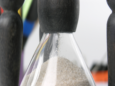 close up.hourglass on blurred background.photo with copy space