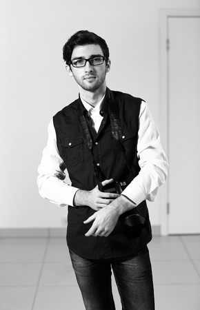 portrait of male photographer in the background of the officeの写真素材