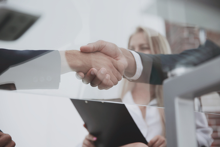bottom view.closeup handshake financial partners.の写真素材