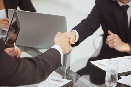 close up. handshake of business partners on a Deskの写真素材