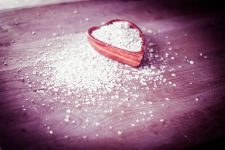 closeup.oat bran cereal on a wooden table.healthy food conceptの写真素材