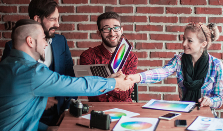 business team and the Manager with a handshake greeted the custoの写真素材