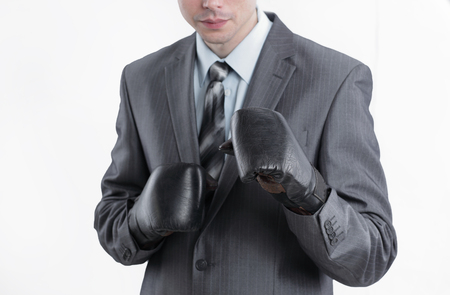 young businessman in Boxing gloves.isolated on whiteの写真素材