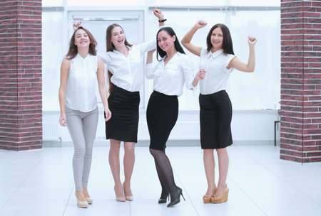 full-length portrait of the triumphant business team.teamwork