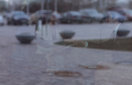 background image. the reflection of the cars in the office Windowsの写真素材