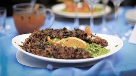 rice pilaf with meat and vegetables on the holiday tableの写真素材
