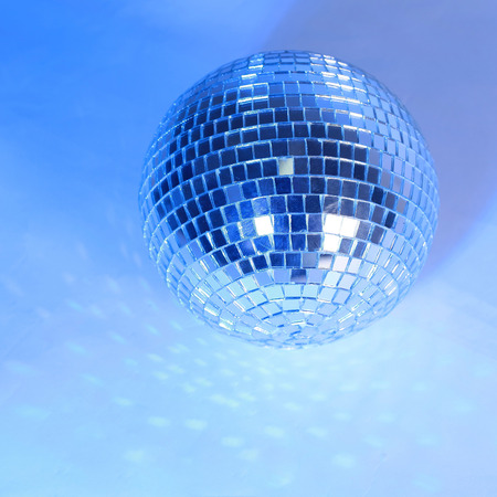 beautiful disco ball on yellow background isolated.の写真素材