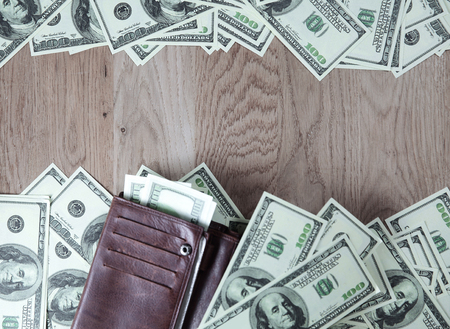 frame for text from of dollar bills on wooden background.businesの写真素材