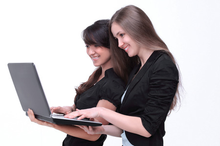 two successful employees looking at laptop screenの写真素材