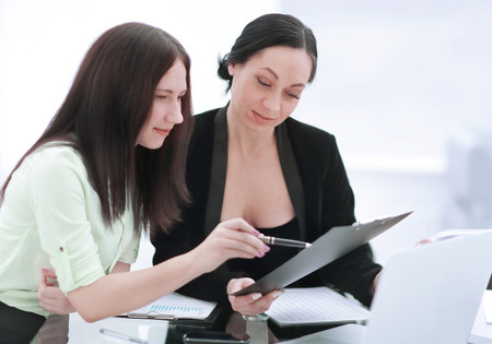 close up.two business women discussing financial documentsの写真素材