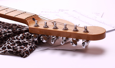closeup fingerboard white electric guitar.isolated on a white bの写真素材