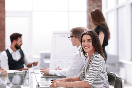 young business woman sitting at office Deskの写真素材