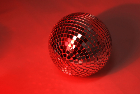 beautiful disco ball on yellow background isolated.の写真素材
