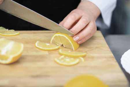 close up.cook the orange slices on a wooden Boardの写真素材