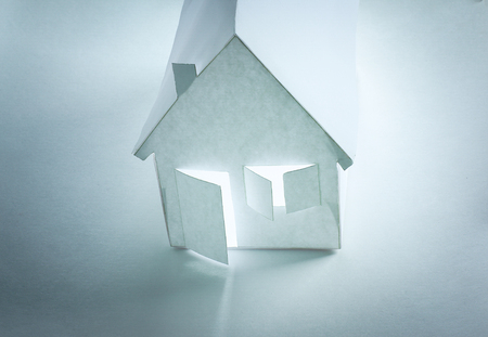 paper house paper background.the concept of a mortgageの写真素材