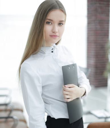 business woman with documents on the background of the officeの写真素材