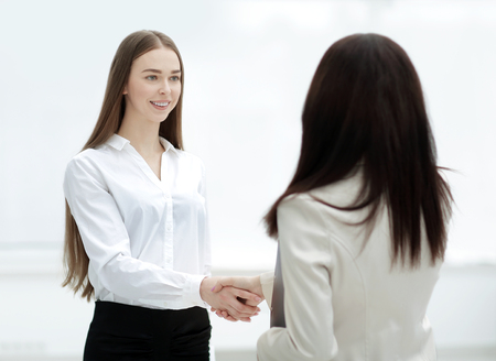 successful business woman shaking hands with employeeの写真素材