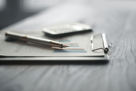 close up.pen and clipboard on the desktop .business conceptの写真素材