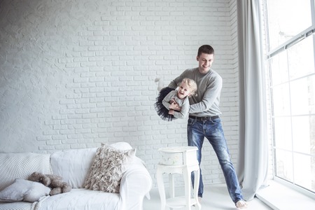 loving father plays with his baby daughterの写真素材