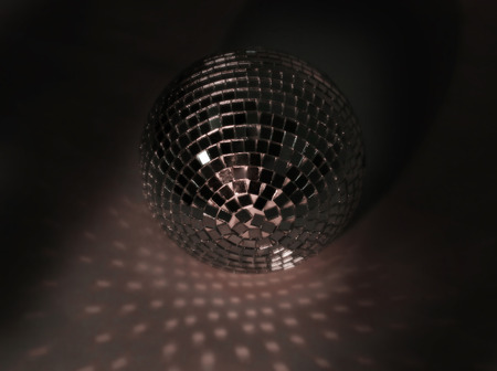 beautiful disco ball on yellow background isolated.の写真素材