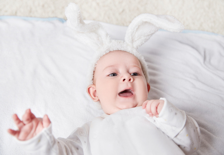 close up. smiling baby in a rabbit suit .