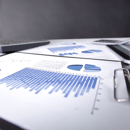business background. financial data on the table at the business team