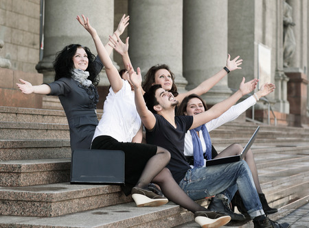 group of happy university students in front of university buildingの写真素材