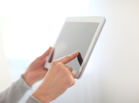 close up.womans hand pressing on screen digital tablet .photo wの写真素材