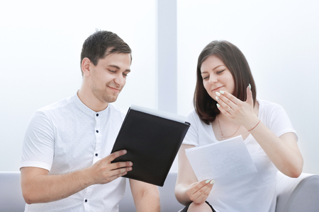 business colleagues discussing new business documents in the office lobbyの写真素材