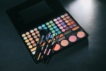 brush and a box of eye shadow makeupの写真素材