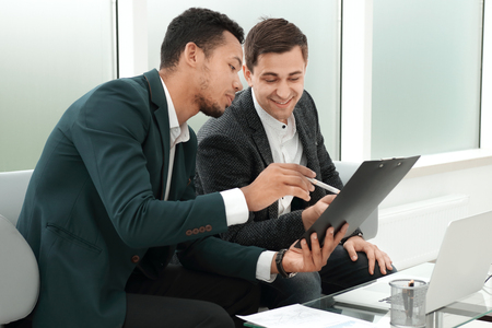 business partners discussing the terms of the contractの写真素材