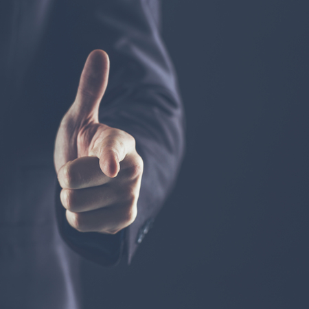 concept of success in business:businessman pointing his finger forward